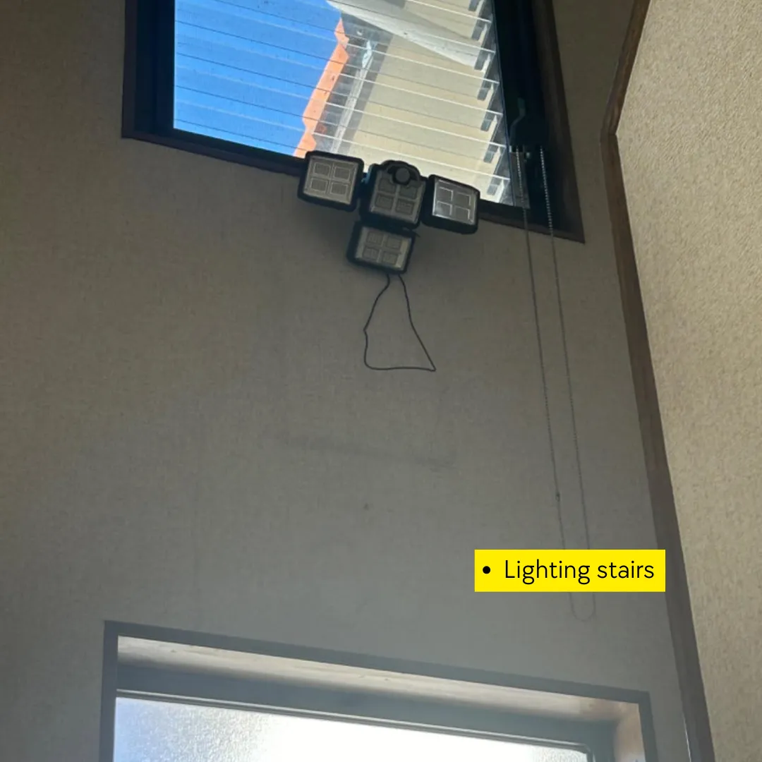 Adjustable 4 head solar motion sensor light lighting the stairs